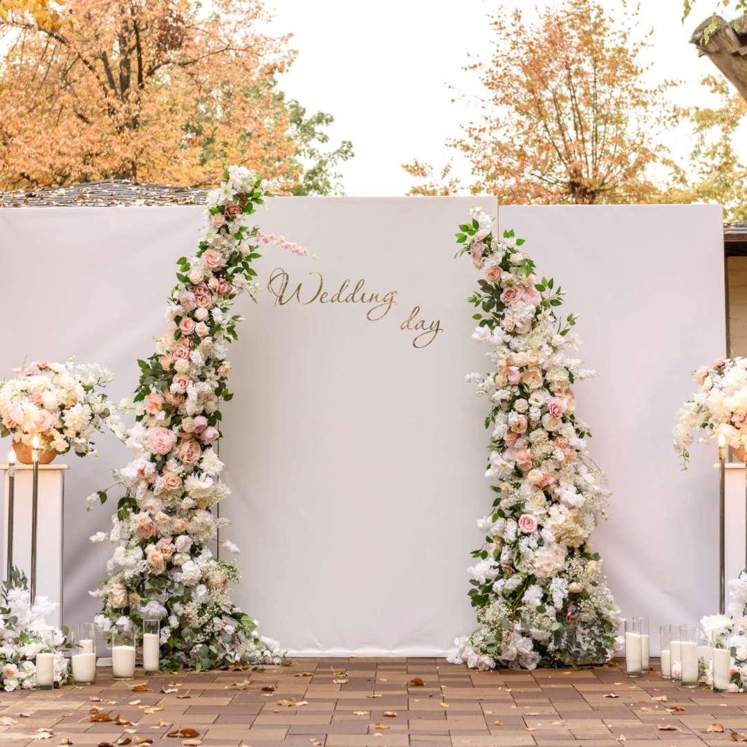 Beautiful floral compositions in the restaurant for the wedding ceremony. Solemn ceremony of painting the groom and bride